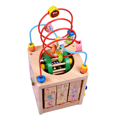 Wooden children's puzzle beetle surrounded by large beads